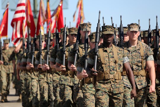 Marines with the 2nd Marine Aircraft Wing perform a pass-in-review for new commanding general, Brig. Gen. Matthew G. Glavy during the 2nd MAW change of command ceremony at Marine Corps Air Station Cherry Point, N.C., June 9, 2016. Maj. Gen. Gary L. Thomas relinquished his post as the 2nd MAW commanding general to Glavy during the ceremony. (U.S. Marine Corps photo by Cpl. N. W. Huertas/Released)