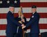 Col. James Boster, 14th Operations Group Commander, passes the 41st Flying Training Squadron guidon to Lt. Col. Derek Oakley, the new 41st FTS Commander, during a change of command ceremony June 9 at Columbus Air Force Base, Mississippi. (U.S. Air Force photo/Melissa Doublin)