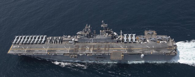 U.S. Marines and Sailors assigned to the 26th Marine Expeditionary Unit (MEU) spell out 26 MEU on the flight deck of the amphibious assault ship USS Kearsarge (LHD 3), Mar.14, 2016 in the Arabian Sea. The 26th MEU is embarked on the Kearsarge Amphibious Ready Group and deployed to maintain regional security in the U.S. 5th Fleet area of operations. (U.S. Marine Corps photo by Gunnery Sgt. Andrew D. Pendracki / 26th MEU Combat Camera / Released)