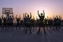Soldiers stretch during sunrise before an early morning run at Camp Arifjan, Kuwait, June 13, 2016. Army photo by Sgt. Brandon Hubbard