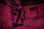 As seen though a night-vision device, airmen maneuver through an urban terrain site in a New Jersey National Guard training center at Joint Base McGuire-Dix-Lakehurst, N.J., June 16, 2016. Training focused on simulating low-light conditions in an urban environment. Air National Guard photo by Tech. Sgt. Matt Hecht