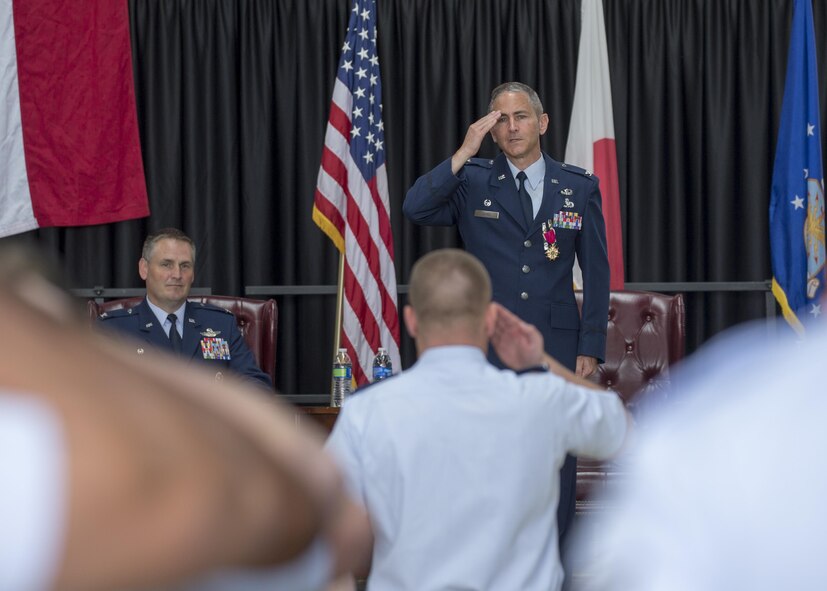 Col. Steven James, 374th Maintenance Group outgoing commander, renders his final salute as commander during a change of command ceremony at Yokota Air Base, Japan, June 20, 2016. (U.S. Air Force photo by Yasuo Osakabe/Released)