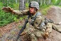 Army Spc. Colton Gobel yells an order to members of his team to provide security before he tends to a simulated casualty during the Ready Warrior Competition at Camp Madbull at Joint Base Elmendorf-Richardson, Alaska, June 23, 2016. Gobel is assigned to the 539th Composite Truck Company (Light), 17th Combat Sustainment Support Battalion. Air Force photo by Justin Connaher 