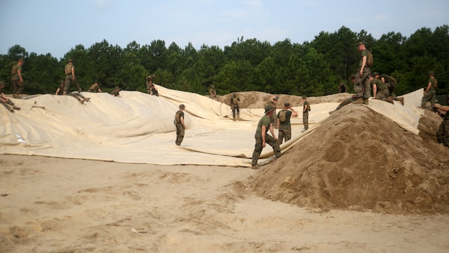 Marines with Bulk Fuel Company, 8th Engineer Support Battalion, set up an amphibious assault fuel system at Marine Corps Base Camp Lejeune, North Carolina, June 24, 2016. A completed AAFS can hold approximately 1.12 million gallons of fuel, which is capable of supporting an entire Marine Expeditionary Force. 