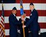 Col. Anthony Sansano, 14th Mission Support Group Commander, passes the 14th Civil Engineer Squadron guidon to Lt. Col. David Jokinen, the new 14th CES Commander, during a change of command ceremony June 28 at Columbus Air Force Base, Mississippi. (U.S. Air Force photo/Sharon Ybarra)
