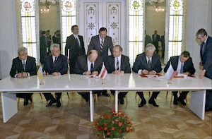 Leaders from Russia, Belarus, and the Ukraine gathered to sign the documents dissolving the Soviet Union and creating the Commonwealth of Independent States on December 8, 1991. 