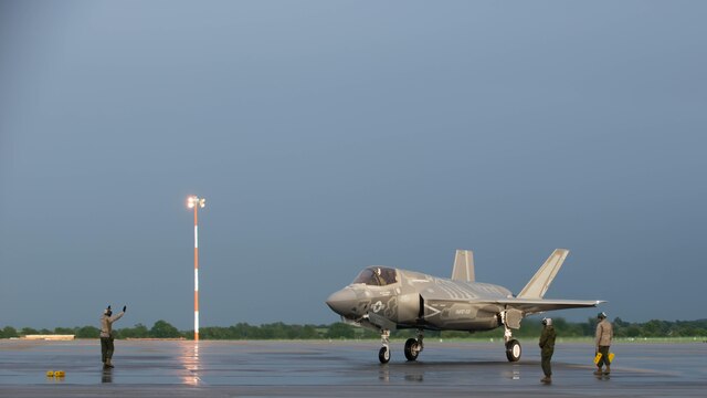 A Marine guides an F-35B Lightning II at Royal Air Force Base Fairford in the United Kingdom after the first F-35 trans-Atlantic flight, June 29, 2016. Three F-35B’s flew from Marine Corps Air Station Beaufort, South Carolina and landed at RAF Fairford in Gloucester, England. They were assisted by two KC-10’s and refueled 15 times over the Atlantic Ocean. 