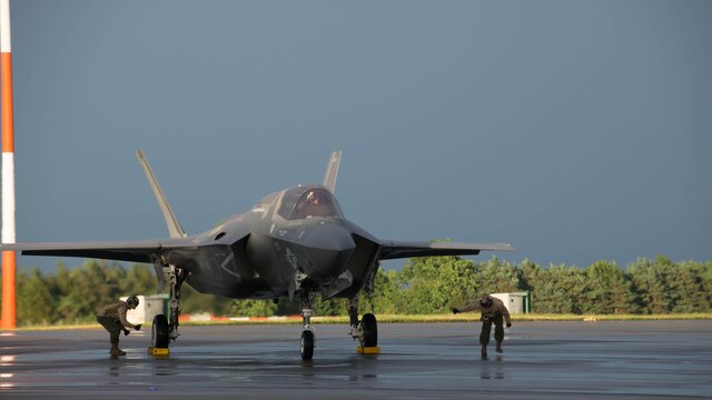 Marines set up chalks and chains on an F-35B Lightning II at Royal Air Force Base Fairford in the United Kingdom after the first F-35 trans-Atlantic flight, June 29, 2016. Three F-35B’s flew from Marine Corps Air Station Beaufort, South Carolina and landed at RAF Fairford in Gloucester, England. They were assisted by two KC-10’s and refueled 15 times over the Atlantic Ocean. 