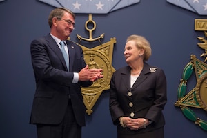 Defense Secretary Ash Carter applauds former Secretary of State Madeleine Albright for her public service achievements before he presents her with the Department of Defense Medal for Distinguished Public Service at the Pentagon June 30, 2016. DoD photo by Senior Master Sgt. Adrian Cadiz<br />
