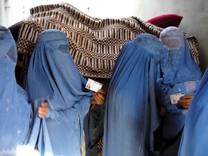 Afghan women standing in line to vote for Afghanistan’s national assembly.