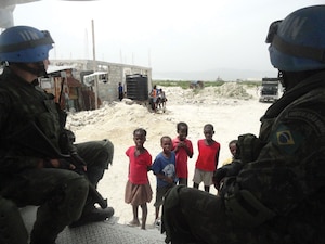 Brazilian soldiers of the MINUSTAH peacekeeping contingent on a routine patrol in Cité Soleil, Haiti.