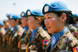 Mongolian peacekeepers stand at attention as they receive their medals for their service in the Republic of South Sudan.