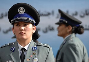 An Afghan National Policewoman (ANP) stands at attention