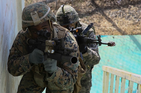 U.S. Marine Corps Lance Cpl. Johnathan Williams, a mortarman, clears a house with Sgt. Jung Ti Hyung an infantry Marine with the Republic of Korea in an integrated training exercise during exercise Ssang Yong in Pohang, South Korea, March 9, 2016.   Williams is assigned a member of Weapons Company, 1st Battalion, 3rd Marine Regiment, “The Lava Dogs”, currently assigned to 4th Marine Regiment while on unit deployment program to Okinawa, Japan.   Exercise Ssang Yong 16 is a biennial military exercise focused on strengthening the amphibious landing capabilities of the Republic of Korea, the U.S., New Zealand and Australia.