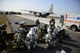 First responders from the 51st Fighter Wing provide assistance to mock wounded personnel during exercise Beverly Midnight 16-01 March 9, 2016, at Osan Air Base, South Korea. This particular exercise scenario involved a C-130H Hercules assigned to the 374th Airlift Wing from Yokota AB, Japan, which took simulated small-arms fire from opposing forces upon landing. (U.S. Air Force photo/Staff Sgt. Jonathan Steffen)