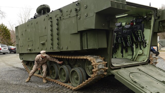 Maj. Paul Rivera, the Amphibious Assault Vehicle Survivability Upgrade Project team lead, gives a presentation at Marine Corps Base Quantico, Va., March 15, 2016. The AAV SU, or amphibious assault vehicle survivability upgrade, will build upon the existing hull. The upgrades include additional armor, blast-mitigating seats and spall liners. They may also include fuel tank protection and automotive and suspension upgrades to keep both land and sea mobility regardless of the added weight. 