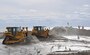 Sand is being pumped while Bulldozers move sand around for a beach restoration project at Smith Point County Park.