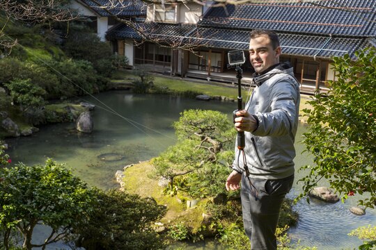Lance Cpl. Yoan Padezhki, aviation supply specialist with Marine Aerial Refueler Transport Squadron(VMGR) 152, located at Marine Corps Air Station Iwakuni, takes a picture with his camera during a Single Marine Program trip to Kannon-in Temple in Tottori Sakyu, Japan, March 20, 2016. During the two-day trip, Marines also visited the Kannon-in Temple on the eastern side of Tottori City. Constructed during the Edo Period from 1603-1867, the temple is best known for its Japanese-style landscape garden consisting of a large pond surrounded by a lawn and tall pine and maple trees. (U.S. Marine Corps photo by Lance Cpl. Aaron Henson/Released)