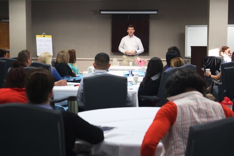 Col. Jeffrey Smitherman gives an introduction to the newly instated three-day District Spouse Orientation Course for recruiting spouses across 6th Marine Corps District March 23, 2016, at Beaufort Air Station, Beaufort, S.C. In Smitherman's brief, he answered questions about recruiting, sexual misconduct, and female integration into ground combat units. Smitherman is the commanding officer of the 6th Marine Corps Recruiting District, Parris Island, South Carolina. (Official Marine Corps photo by Cpl. Diamond N. Peden/Released)
