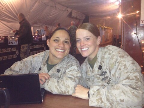 Chief Petty Officer Jaclyn Place poses for a picture with her friend Chief Petty Officer 2 Breighanna Cather. Place is a lead chief petty officer with the Headquarters Regimental Aid Station, 1st Marine Logistics Group, and was awarded an impact Navy and Marine Corps Commendation Medal for her selfless and decisive actions that saved the lives of her neighbors. (U.S. Marine Corps photo by Sgt. Laura Gauna/released)