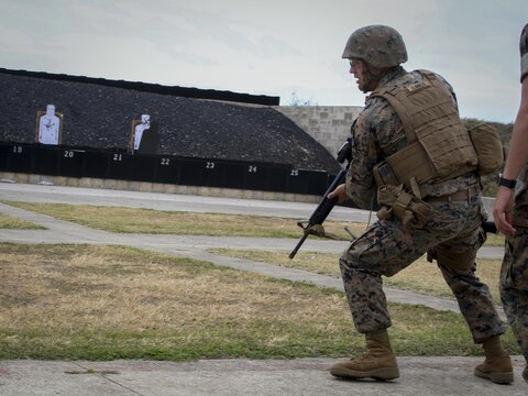 MARINE CORPS BASE HAWAII — Cpl. Zachary Summers, a radio operator with 3rd Radio Battalion runs from one side of the range to the other as part of a course of fire during the Pacific Combat Shooting Match at the Kaneohe Bay Range Training Facility aboard Marine Corps Base Hawaii, March 16, 2016. Teams from different units used various weapons and tactics to achieve the fastest time possible on different courses of fire, while earning points for awards during the competition. Marines from the Marine Corps Combat Shooting Team instructed and gave advice to the Marines participating in the event. (U.S. Marine Corps Photo by Lance Cpl. Jesus Sepulveda Torres)