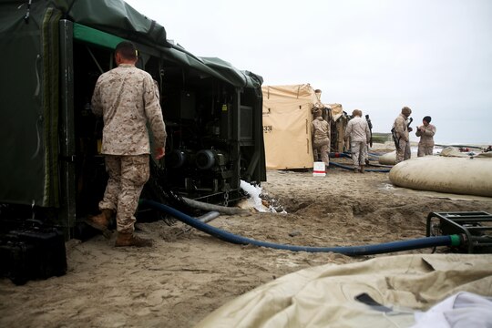 Marines with Utilities Platoon, Headquarters and Support Company, 7th Engineer Support Battalion, 1st Marine Logistics Group, operate four tactical water purification systems during a utilities exercise at Red Beach aboard Camp Pendleton, Calif., March 21, 2016. Utilities Platoon conducted an eight-day field exercise which focused on their ability to provide clean water and stable power to a unit located in an environment without standard utility resources. (U.S. Marine Corps photo by Cpl. Carson Gramley/released)