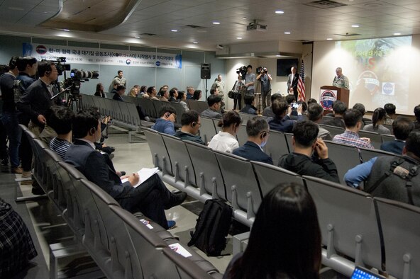 Col. Andrew Hansen, 51st Fighter Wing commander, gives opening remarks to the media during the Korea United States-Air Quality (KORUS-AQ) Experiment media day at Osan Air Base, Republic of Korea, April 29, 2016. KORUS-AQ will collect air quality data over the Republic of Korea using aircraft, ground sites and ships from May 2 until June 12. The U.S. and South Korean aircraft will conduct coordinated flights from Osan Air Base. (U.S. Air Force photo by Staff Sgt. Jonathan Steffen/Released)