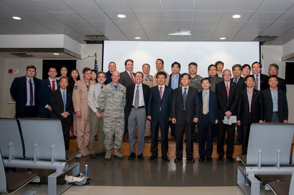 Marc Knapper, U.S. Embassy Seoul deputy chief of mission, and Col. Andrew Hansen, 51st Fighter Wing commander, pose for a group photo with the Korea United States-Air Quality (KORUS-AQ) Experiment team and distinguished visitors at the media day on Osan Air Base, Republic of Korea, April 29, 2016. KORUS-AQ will collect air quality data over the Republic of Korea using aircraft, ground sites and ships from May 2 until June 12. The U.S. and South Korean aircraft will conduct coordinated flights from Osan Air Base. (U.S. Air Force photo by Staff Sgt. Jonathan Steffen/Released)