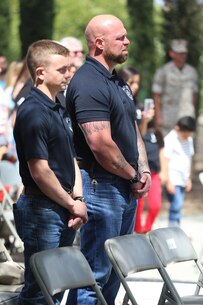 MARINE CORPS BASE CAMP PENDLETON, Calif. – 1st Sgt. Chris Carlisle listens to Col. Jason Morris during the 3rd Battalion, 5th Marine Regiment “Dark Horse” Reunion at the San Mateo Memorial Garden April 29, 2016. Carlisle served as the Company K company gunnery sergeant during the battalion’s deployment to Sangin, Afghanistan in the fall of 2010. (U.S. Marine Corps photo by Lance Cpl. Shellie Hall/Released)