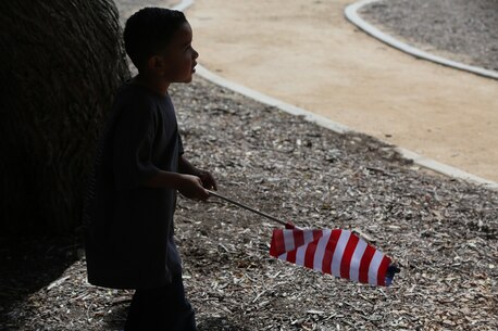 MARINE CORPS BASE CAMP PENDLETON, Calif. – A young boy waves the American flag during the 3rd Battalion, 5th Marine Regiment “Dark Horse” Reunion at the San Mateo Memorial Garden April 29, 2016. The reunion was held to honor the Marines of 3/5 who were deployed to Sangin, Afghanistan in the fall of 2010. (U.S. Marine Corps photo by Lance Cpl. Shellie Hall/Released)