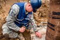 Air Force Technical Sgt. Kevin Taylor stabilizes molding tubes for concrete at Camp Hinds, Raymond, Maine, May 3, 2016. Taylor is a structural craftsman assigned to the 110th Attack Wing Civil Engineering Squadron. Air National Guard photo by Airman Tiffany Clark