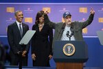 Former Daily Show host Jon Stewart tells jokes as President Barack Obama and First Lady Michelle Obama look on during the comedy show celebrating the 75th anniversary of the USO and the 5th anniversary of the Joining Forces initiative at Joint Base Andrews near Washington, D.C. May 5, 2016. DoD photo by E.J. Hersom