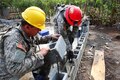 Army Pvt. Dyllion Waterhouse, right, spreads wet cement before laying bricks for a new school being built as part of Beyond the Horizon 2016 in Catarina, Guatemala, April 28, 2016. Waterhouse is an engineer assigned to the 994th Engineer Company. Army photo by Spc. Glenaj Washington
