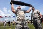 Army Pfc. Harlan Troutman, left, hoists a training round above his head during the Gen. Gordon Sullivan Cup best tank crew competition at Fort Benning, Ga., May 1, 2016. Troutman is assigned to the Tennessee Army National Guard’s 2nd Squadron, 278th Armored Cavalry Regiment. Army photo by Sgt. 1st Class Jon Soucy