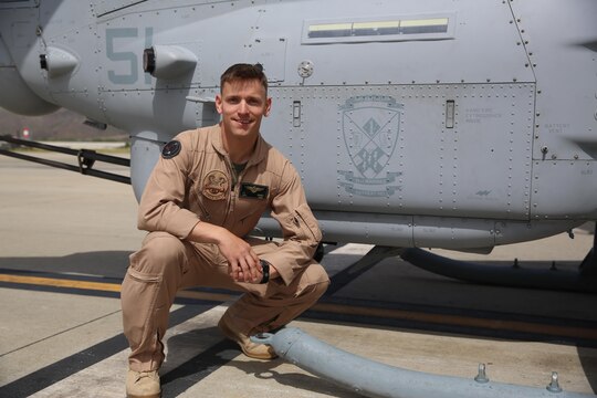 Capt. Jason Grimes, an AH-1Z Cobra pilot with Marine Light Attack Helicopter Squadron (HMLA) 369, poses next to the logo for 2nd Battalion, 5th Marine Regiment, painted on the side of a Cobra aboard Marine Corps Air Station Camp Pendleton, Calif., April 26. Squadrons with Marine Aircraft Group (MAG) 39 are partnered with ground units from 1st Marine Division to build stronger relationships as a part of MAG-39’s new integration effort. (U.S. Marine Corps photo by Cpl. Alissa P. Schuning/Released)