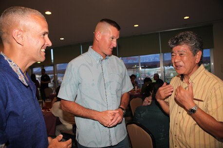 Col. Christopher Snyder, MCIPAC Chief of Staff, Col. David Odom, the commanding officer of Camp Schwab, and Munakastu Kayo, the Henoko Mayor talk during the Camp Schwab's Commander Social May 14. Local community leaders were invited to discuss the good relationships between their communities and Marine Corps Installations Pacific.