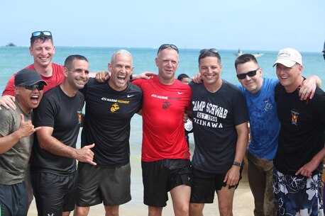 Col. David Odom, the commanding officer of Camp Schwab, participates in the Dragon Boat Races May 15 with his team. The races is a great way to experience the rich cultural history of Okinawa while having fun and making new friends.