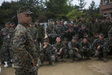 U.S. Marines and Sailors with Alpha Company, 1st Battalion, 3rd Marine Regiment, also known as “The Lava Dogs”, present a gift to Republic of Korea (ROK) marines during the Korean Marine Exchange Program (KMEP) in South Korea, April 13, 2016. KMEP is a program designed to increase interoperability and camaraderie between U.S. Marines and ROK marines. The alliance between America and the Republic of Korea has grown ever stronger based upon the shared interests and common values of both nations. (U.S. Marine Corps photo by MCIPAC Combat Camera Lance Cpl. Sean M. Evans/ Released)