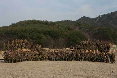 U.S. Marines with 1st Battalion, 3rd Marine Regiment, also known as “The Lava Dogs”, and 1st Tanks, 4th Marine Regiment, pose for a group photo with Australian soldiers with Bravo Company, 6th Royal Australian Regiment during exercise Ssang Yong 16 in South Korea, March 17, 2016. Ssang Yong is a biennial combined amphibious exercise conducted by forward deployed U.S. forces with the Republic of Korea Navy and Marine Corps, Australian Army and Royal New Zealand Army Forces in order to strengthen our interoperability and working relationships across a wide range of military operations - from disaster relief to complex expeditionary operations. The American-Australian alliance has grown ever stronger based upon the shared interests and common values of both nations. (U.S. Marine Corps photos by MCIPAC Combat Camera Lance Cpl. Sean M. Evans/ Released)