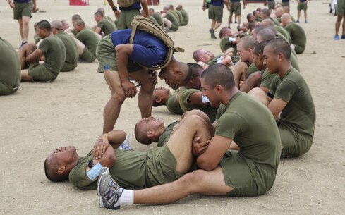 Recruits of Lima Company, 3rd Recruit Training Battalion, conduct crunches during an inventory physical fitness test at Marine Corps Recruit Depot San Diego, May 16. Recruits will take a final PFT during week 10 of training and will be able to track any improvements made over time. Annually, more than 17,000 males recruited from the Western Recruiting Region are trained at MCRD San Diego. Lima Company is scheduled to graduate June 10.