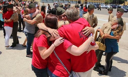 A Marine from Charlie Company, 1st Recruit Training Battalion, hugs his loved ones after being released for liberty at Marine Corps Recruit Depot San Diego, May 19. After the Marines were released, they were allowed five hours of on-base liberty before graduation on Friday. Annually, more than 17,000 males recruited from the Western Recruiting Region are trained at MCRD San Diego. Charlie Company is scheduled to graduate May 20.
