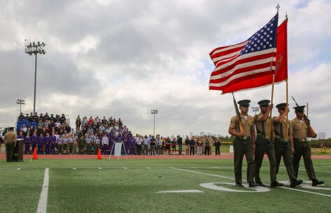 The color guard from Support Battalion, Marine Corps Recruit Depot San Diego, marches off the field during the opening ceremony of the National High School Physical Fitness Championships at MCRD San Diego, May 20. The event is sponsored by the United States Marines Youth Foundation, Inc. and is a five-event competition consisting of sit-ups, push-ups, broad jump, pull-ups and a shuttle run. High school students from across the country competed in local and state competitions before making it the championships at the depot.