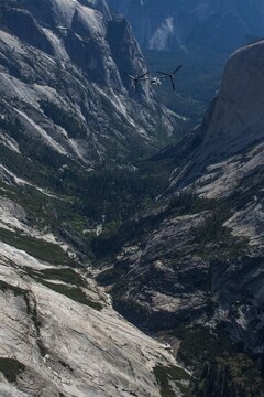 Marines with Marine Medium Tiltrotor Squadron (VMM) 161 “Greyhawks,” fly over Yosemite National Forest, Calif., May 19. Lt. Col. Andreas Lavato, commanding officer of VMM-161, conducted his last flight with the squadron prior to his change of command May 26. (U.S. Marine Corps photo by Sgt. Lillian Stephens/Released)