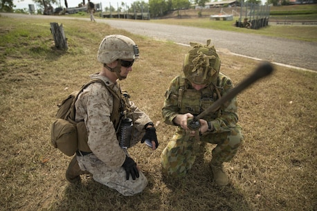 U.S. Marine Sgt. Devon L. Ward and Australian Army Pvt. Jacob Handley, combat engineers, perform a radio check at Hidden Valley Motor Sports Complex, Northern Territory, Australia, on May 19, 2016. U.S. Marine and Australian Army combat engineers conducted clearing training to find improvised explosive device and caches. Marine Rotational Force - Darwin is a six-month deployment of Marines into Darwin, Australia, where they will conduct exercises and train with the Australian Defence Forces, strengthening the U.S.-Australia alliance. Ward, from Grand Rapids, Michigan, is with 1st Combat Engineer Battalion, MRF-D. Handley, is with 1st Combat Engineer Regiment, 1st Brigade.