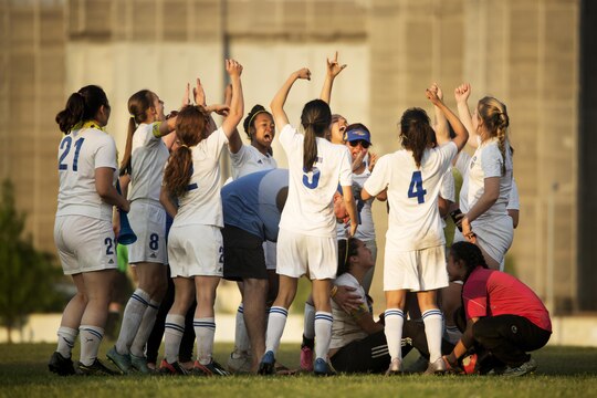 Members of the Panthers girls’ soccer team from Yokota High School, take a moment to celebrate after winning first place in the Far East Soccer Tournament hosted by Matthew C. Perry High School at Marine Corps Air Station Iwakuni May 19, 2016. The Far East Soccer Tournament is the largest soccer event that Department of Defense Education Activity Schools Pacific in Japan, Korea and International Schools have to look forward to compete in all season. (U.S. Marine Corps photo by Lance Cpl. Donato Maffin/Released)