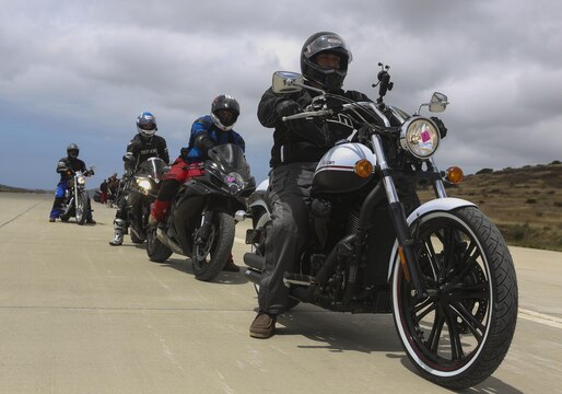 Service members with 3rd Marine Aircraft Wing wait in line to participate in the quick stop and body positioning workshops on the helicopter landing field turned motorcycle track during Motorcycle Rider Preservation Day 2016 in San Mateo Canyon, on Marine Corps Base Camp Pendleton, Calif., May 20. Marine Aircraft Group 39 partnered with Marine Corps Base Camp Pendleton Motorcycle Safety Division to host Motorcycle Rider Preservation Day 2016 for 3rd MAW service members who own bikes. (U.S. Marine Corps photo by Lance Cpl. Harley Robinson/Released)