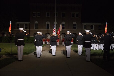 The official party and the parade staff salute the colors during the Friday Evening Parade, May 27, 2016. The guest of honor for the parade was the Honorable Denis McDonough, White House chief of staff, and the hosting official was Gen. Robert B. Neller, commandant of the Marine Corps. (Official Marine Corps photo by Cpl. Chi Nguyen/Released)
