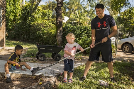 U.S. Marine Lance Cpl. Simon Delacruz helps an Australian preschooler rake a garden at Millner Preschool, Northern Territory, Australia, on May 28, 2016. U.S. Marines with Forward Coordination Element, Marine Rotational Force – Darwin, volunteered with preschool teachers and parents to clean up the schoolyard for preschoolers. MRF-D is a six-month deployment of Marines into Darwin, Australia, where they will contribute to and engage with local communities. Delacruz, from Rochester, New York, is a cyber network operator with FCE, MRF-D.