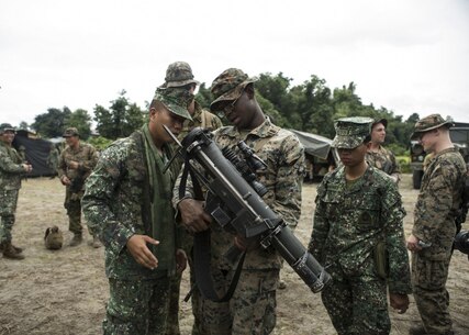 A U.S. Marine shows Philippine Marines the parts and functions of the shoulder-launched multipurpose assault weapon (SMAW) during Philippine Amphibious Landing Exercise 33 (PHIBLEX) on Colonel Ernesto Ravina Air Base, Philippines, Oct. 7, 2016. PHIBLEX is an annual U.S.-Philippine military bilateral exercise that combines amphibious capabilities and live-fire training with humanitarian civic assistance efforts to strengthen interoperability and working relationships. The Philippine Marines are with Battalion Landing Team, 2nd Battalion, 32nd Marine Company. The U.S. Marines are with Battalion Landing Team, 2nd Battalion, 4th Marine Regiment, Echo Company. (U.S. Marine Corps photo by MCIPAC Combat Camera Lance Cpl. Jesula Jeanlouis/Released) 