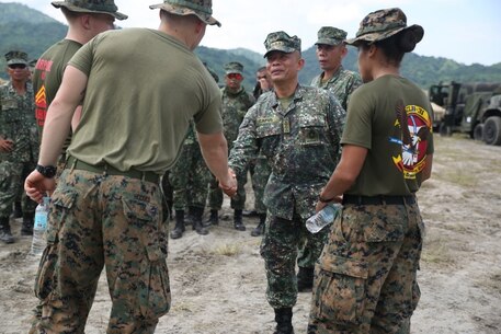 U.S. Marines with Military Police Platoon, Combat Logistics Battalion 31, 31st Marine Expeditionary Unit, greet Marines with the Armed Forces of the Philippines at Colonel Ernesto Ravina Air Base, Philippines, during Philippine Amphibious Landing Exercise 33 (PHIBLEX) Oct. 6, 2016. PHIBLEX is an annual U.S.-Philippine military bilateral exercise combining amphibious capabilities and live-fire training with humanitarian civic assistance efforts to strengthen interoperability and working relationships. (U.S. Marine Corps photo by Sgt. Tiffany Edwards/Released) 